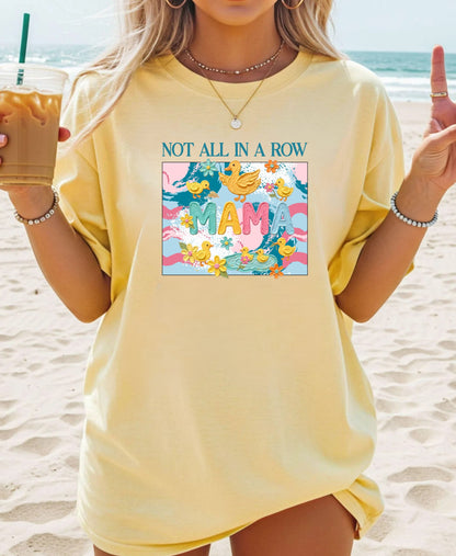 butter "mama" t-shirt with colorful graphic design featuring ducks and text on a white background.