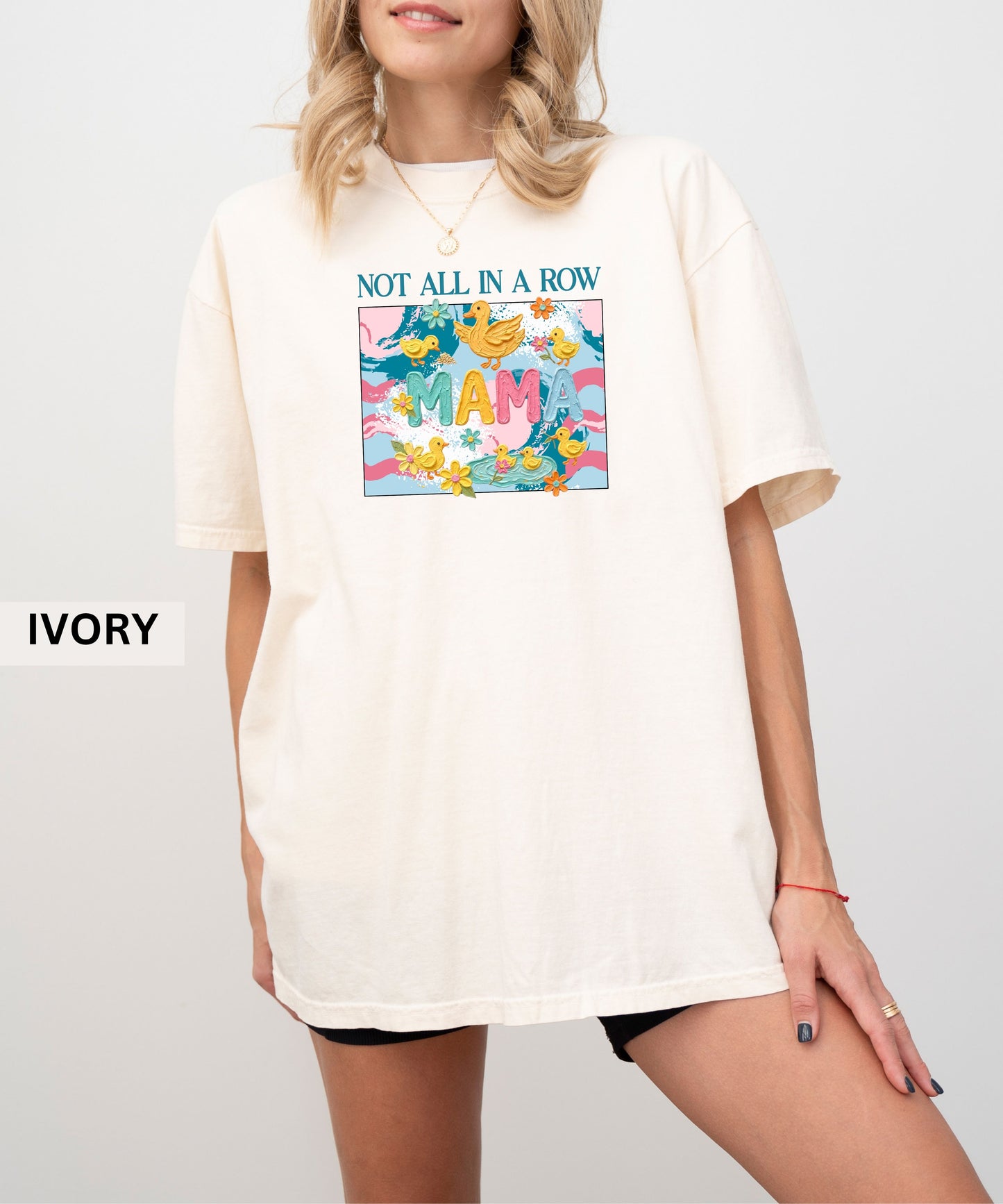 ivory "mama" t-shirt with colorful graphic design featuring ducks and text on a white background.