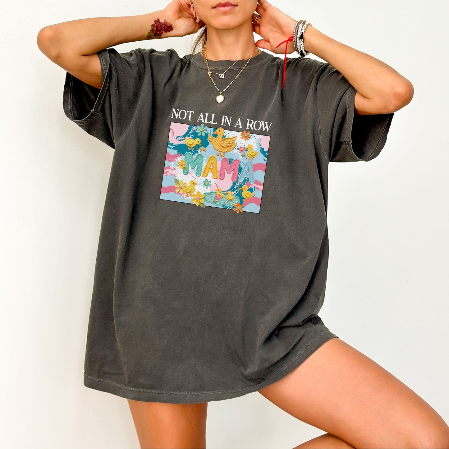 pepper "mama" t-shirt with colorful graphic design featuring ducks and text on a white background.