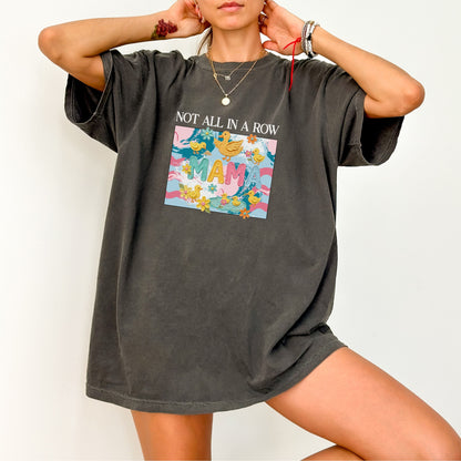 pepper "mama" t-shirt with colorful graphic design featuring ducks and text on a white background.