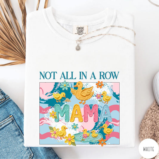 White mama t-shirt with colorful graphic design featuring ducks and text on a white background.