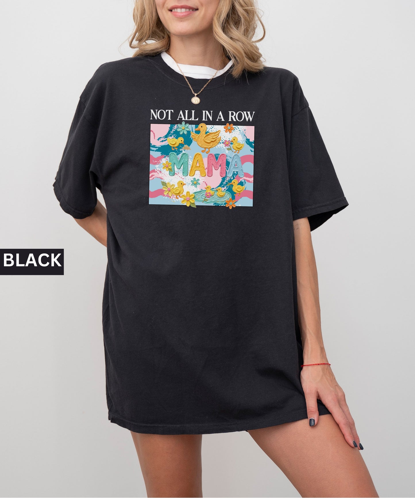 black "mama" t-shirt with colorful graphic design featuring ducks and text on a white background.