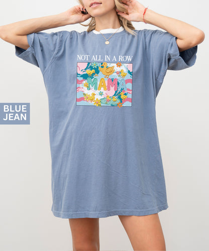 blue jean "mama" t-shirt with colorful graphic design featuring ducks and text on a white background.