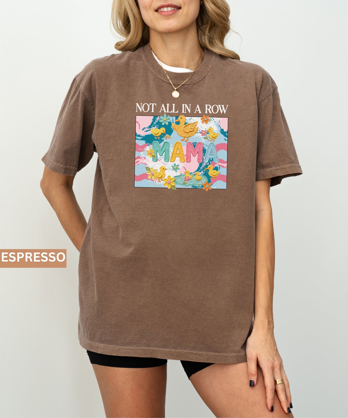 espresso "mama" t-shirt with colorful graphic design featuring ducks and text on a white background.