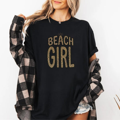 Black t-shirt with 'Beach Girl' text, worn by a person with a plaid shirt over shoulders.