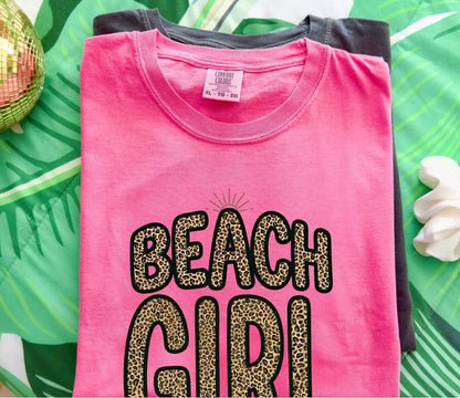 crunchberry color t-shirt with 'Beach Girl' text on a green leafy background