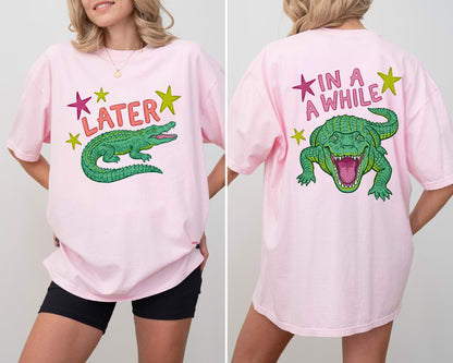 blossom t-shirts with alligator graphics on front "later gator" and the text on back i"n a while crocodile"a plain background