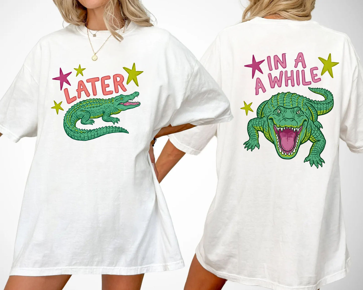 white t-shirts with alligator graphics on front "later gator" and the text on back i"n a while crocodile"a plain background