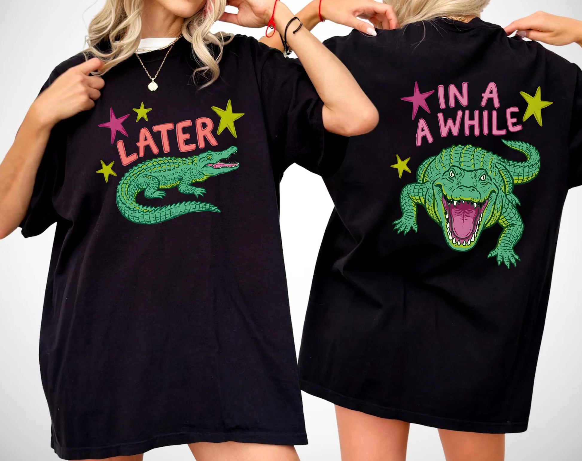 black t-shirts with alligator graphics on front "later gator" and the text on back i"n a while crocodile"a plain background