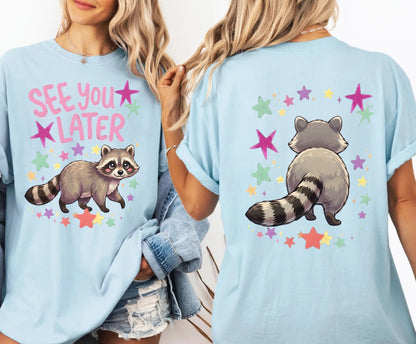 chambray t-shirt with raccoon graphic and 'See You Later' text on the front with cute raccoon and cute raccoon on back of shirt on a white background