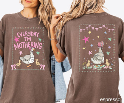 Two espresso t-shirts with front and back graphic designs of a mother goose her ducklings with phrase "everyday im mothering" and text on a white background