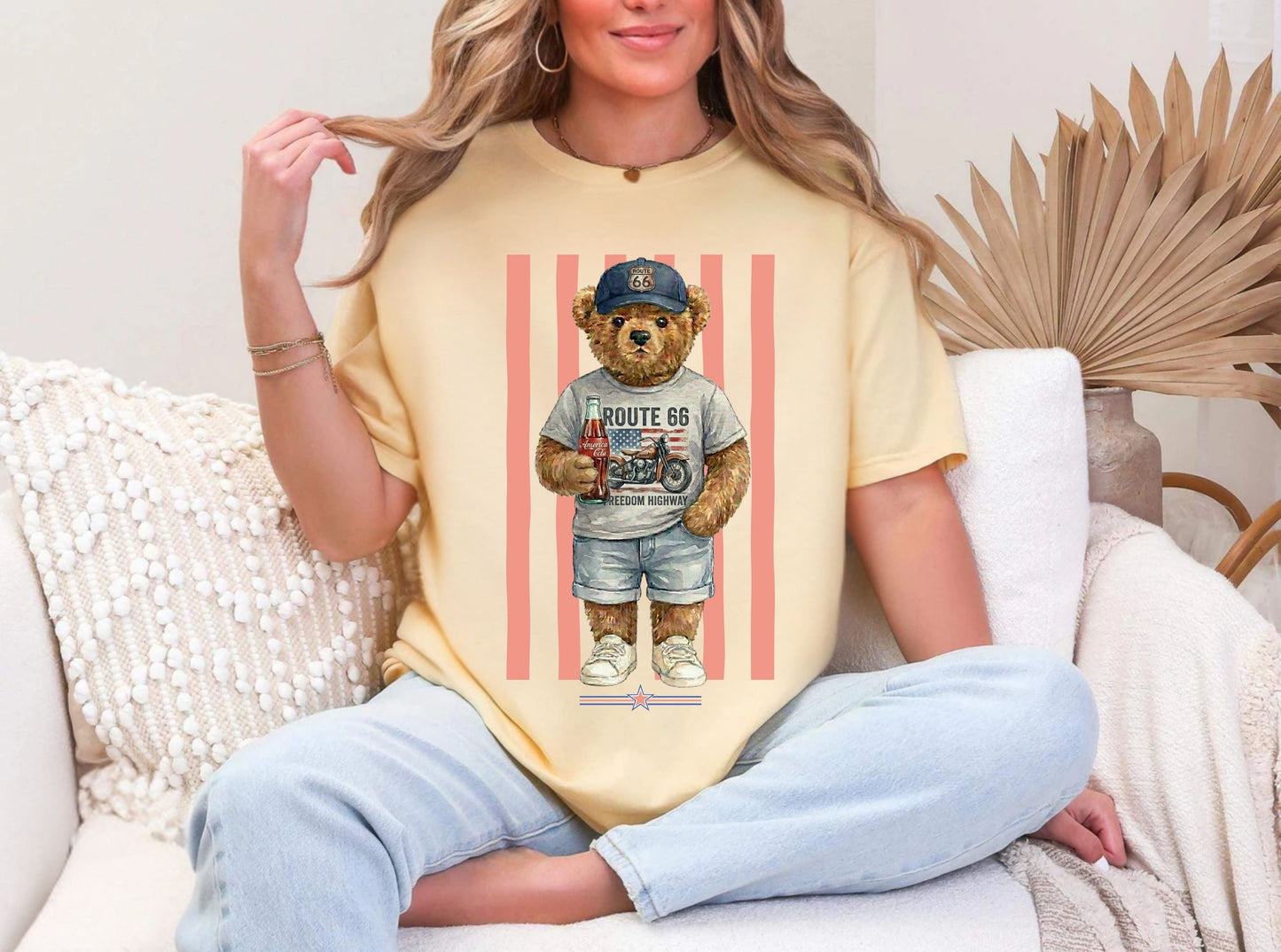 Person wearing a banana t-shirt with a bear graphic sitting on a couch.