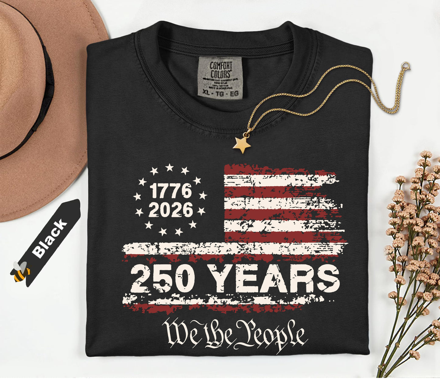 Black t-shirt with American flag design and text on a white background