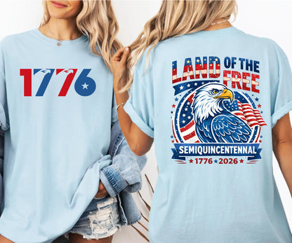 chambray t-shirt with 'Land of the Free' design featuring an eagle and American flag, worn by a person.