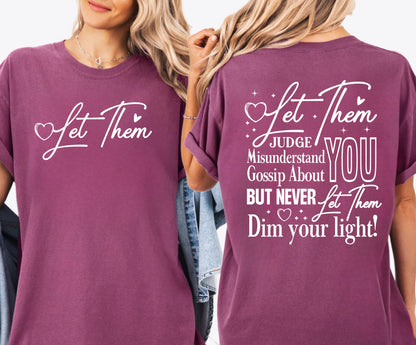 Berry t-shirt with motivational quote on front and back worn by a person.