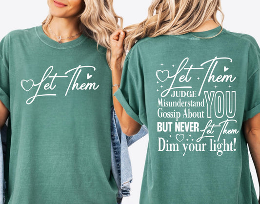 Two people wearing light green t-shirts with motivational quotes on a white background