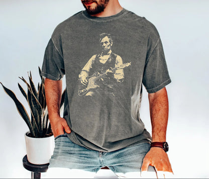 pepper t-shirt with a graphic of a president lincoln  playing guitar on a white background