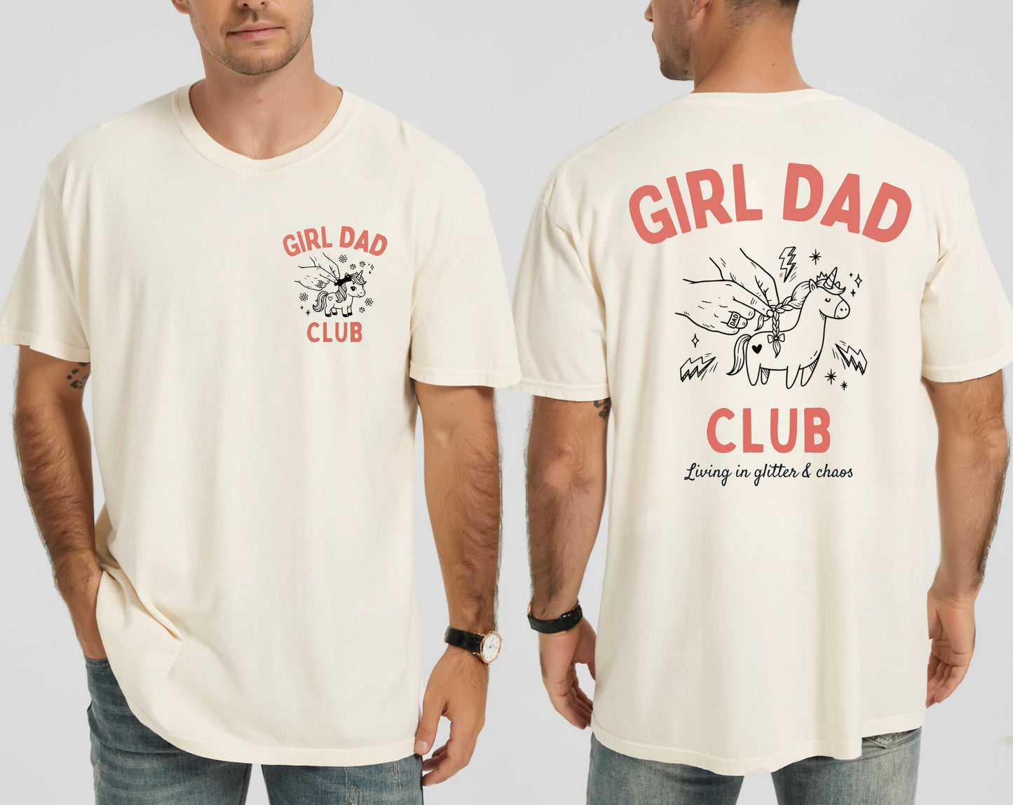 Man wearing an ivory t-shirt with 'Girl Dad Club' text and graphics on a plain background