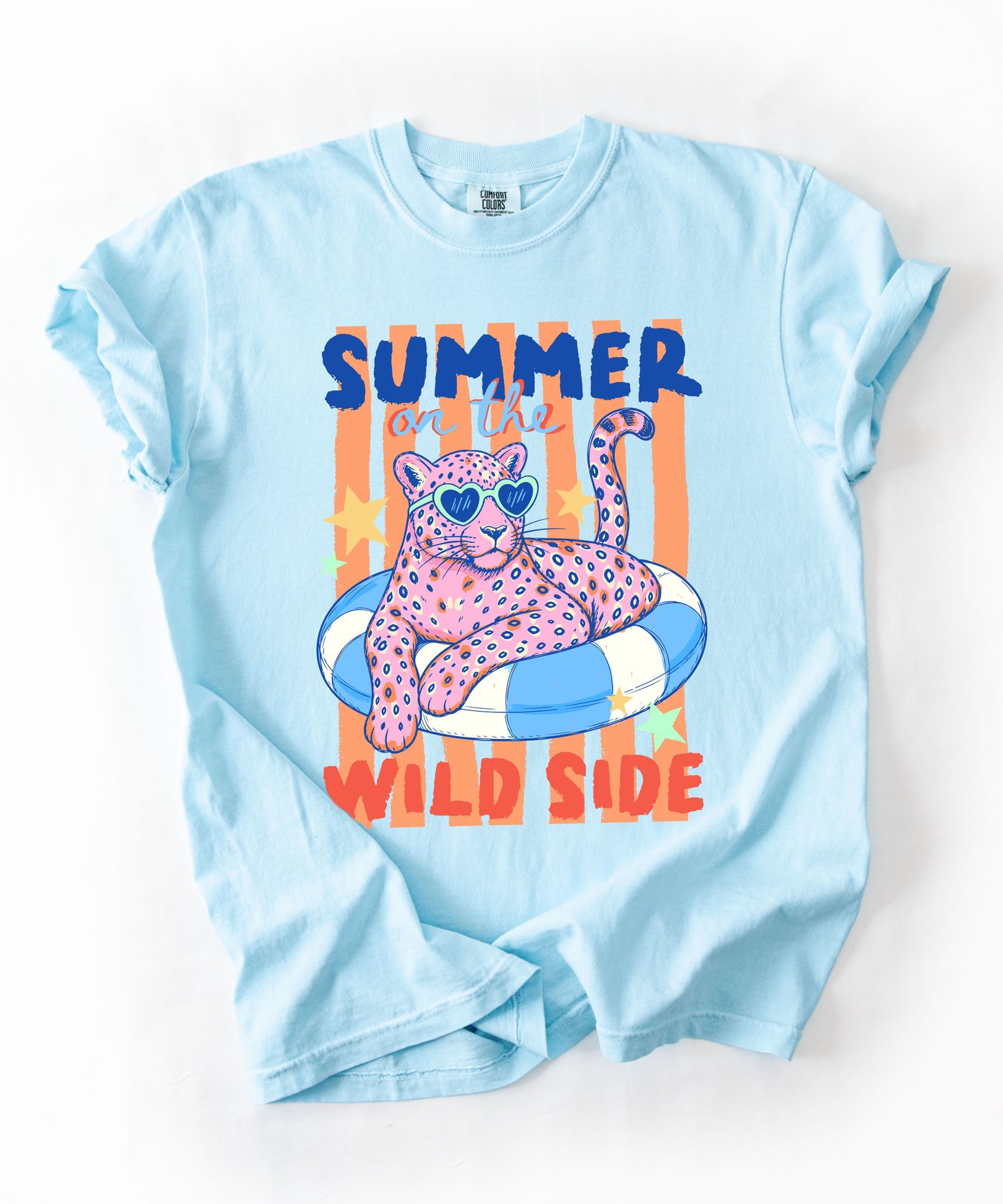 chambray colored  t-shirt with a graphic of a leopard on an inflatable ring and 'Summer on the Wild Side' text.