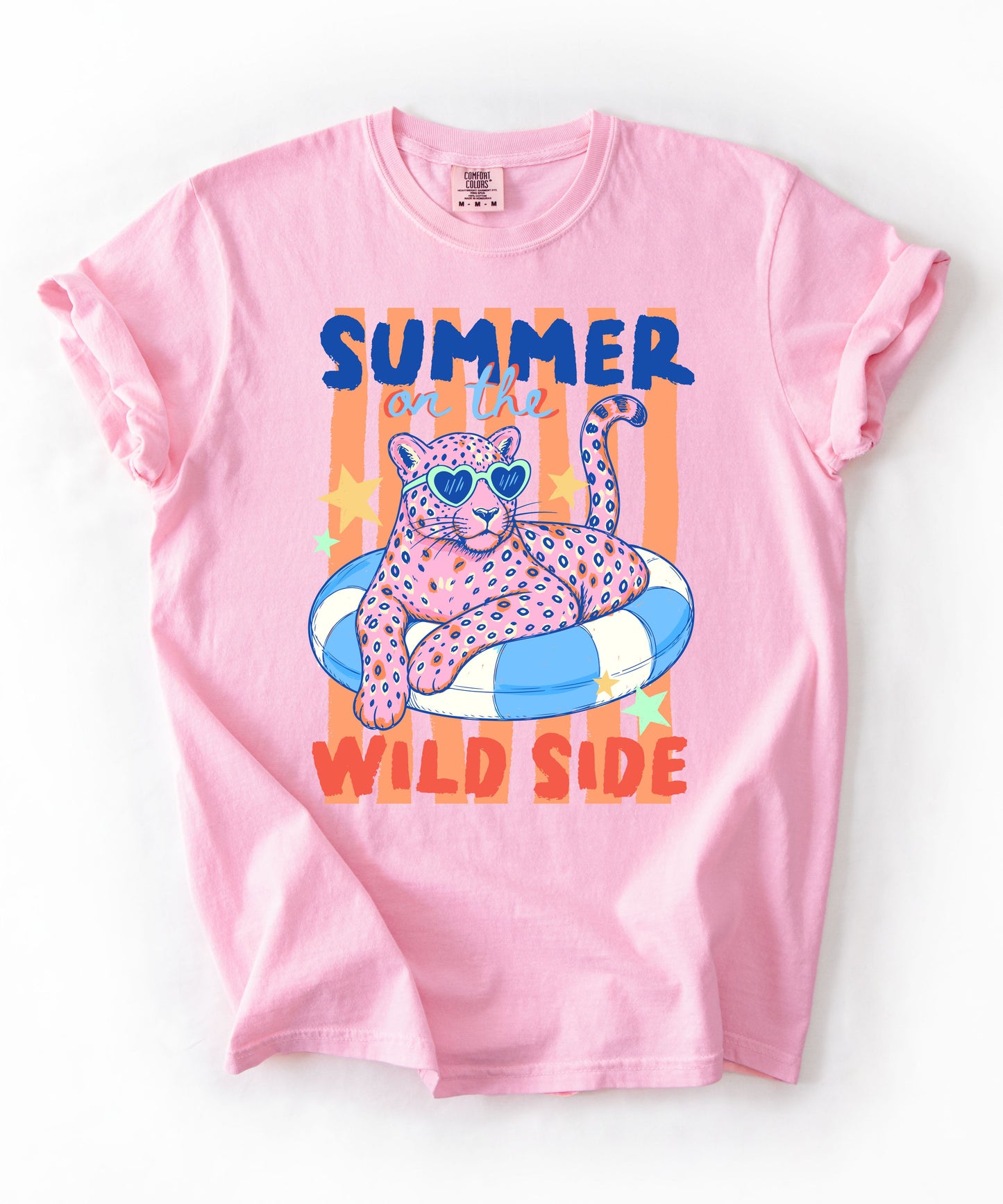 blossom colored  t-shirt with a graphic of a leopard on an inflatable ring and 'Summer on the Wild Side' text.