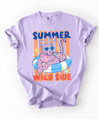 orchid colored  t-shirt with a graphic of a leopard on an inflatable ring and 'Summer on the Wild Side' text.