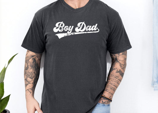 Person wearing a black t-shirt with 'Boy Dad' text on a white background