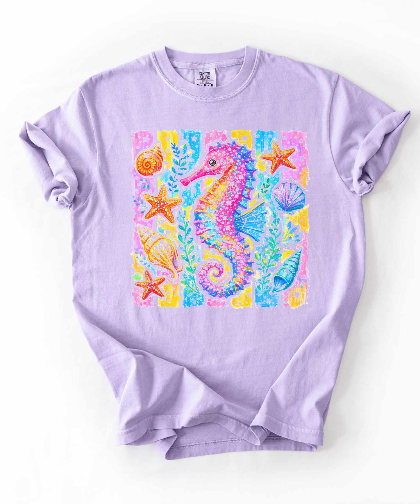 Seahorse Beach Art T-Shirt in Orchid — watercolor seahorse with shells and starfish graphic, garment-dyed comfort colors tee
