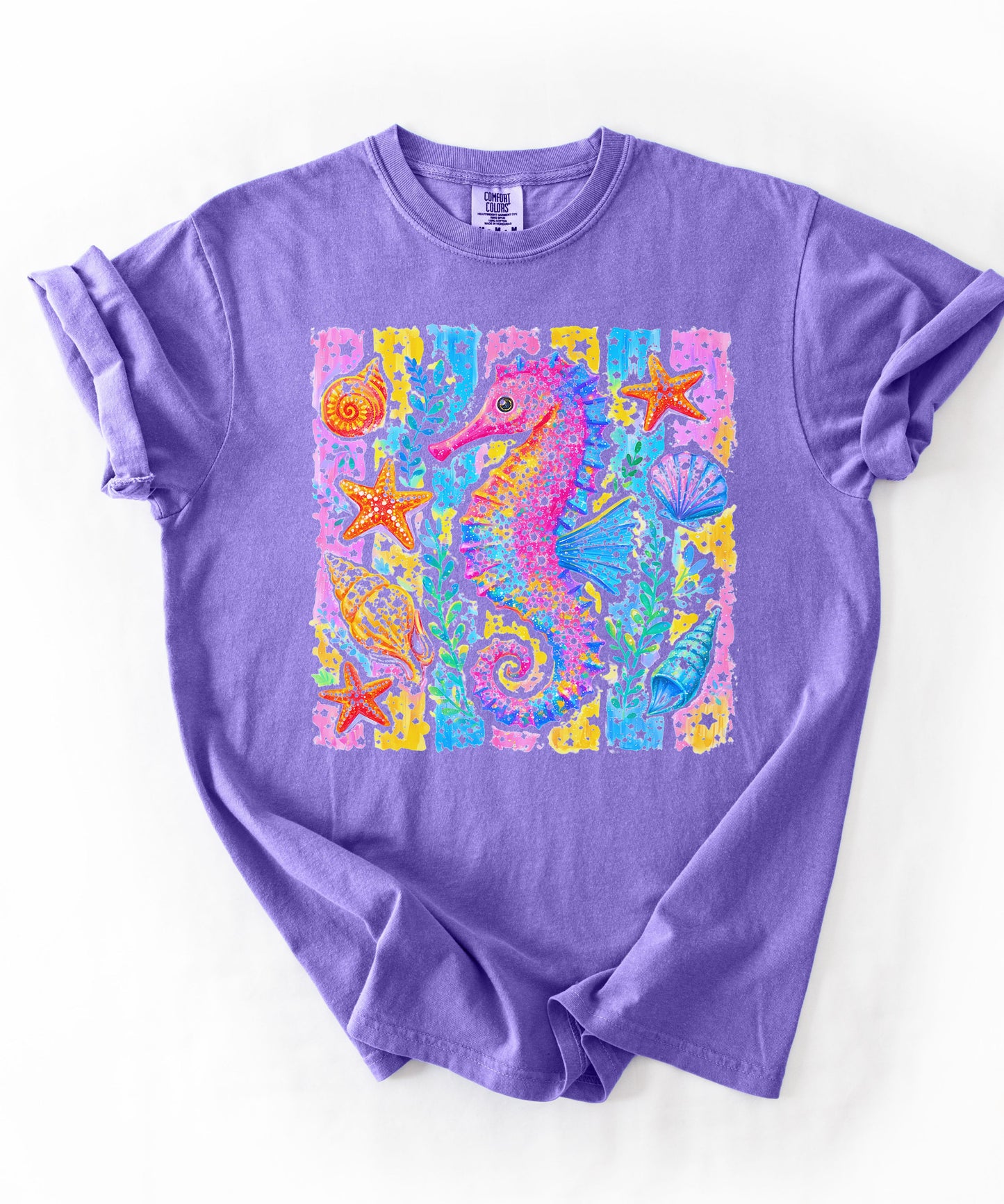 Seahorse Beach Art T-Shirt in Violet — watercolor seahorse with shells and starfish graphic, garment-dyed comfort colors tee
