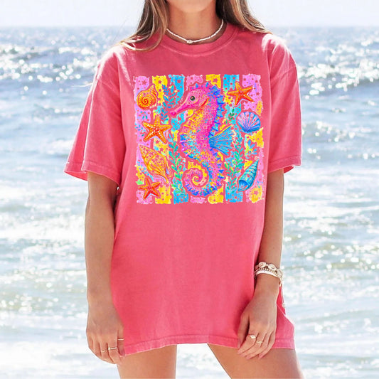 Seahorse Beach Art T-Shirt in Watermelon — watercolor seahorse with shells and starfish graphic, garment-dyed comfort colors tee
