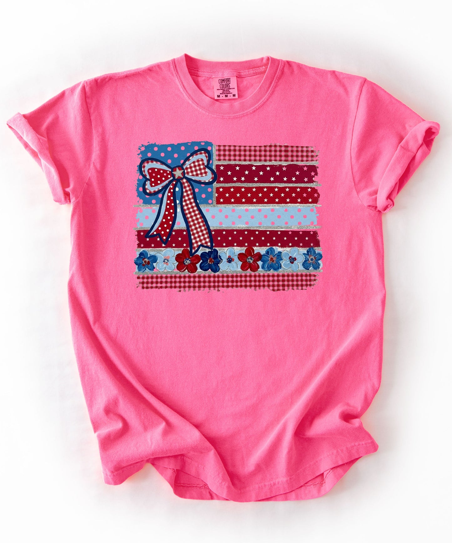 Neon Pink garment-dyed t-shirt with Americana patchwork flag bow graphic in red, white and blue