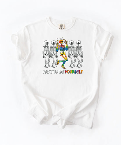 Dare to Be Yourself Rainbow Skeleton T-Shirt in White — garment-dyed Halloween Pride tee
