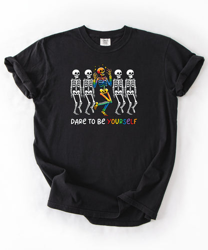 Dare to Be Yourself Rainbow Skeleton T-Shirt in Black— garment-dyed Halloween Pride tee