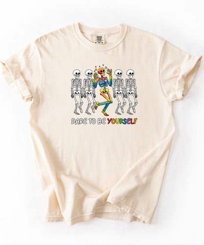 Dare to Be Yourself Rainbow Skeleton T-Shirt in Ivory — garment-dyed Halloween Pride tee