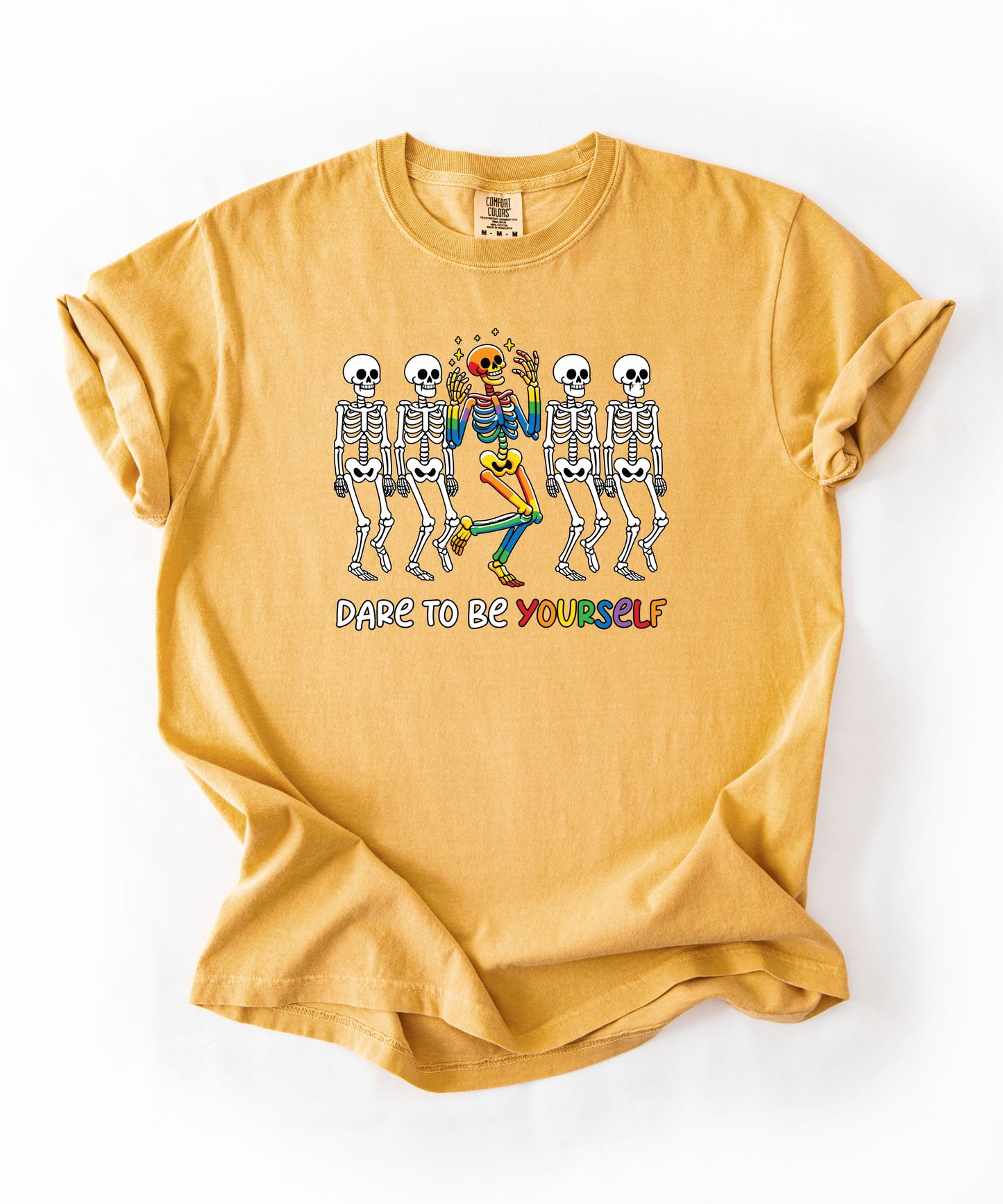 Dare to Be Yourself Rainbow Skeleton T-Shirt in Mustard— garment-dyed Halloween Pride tee