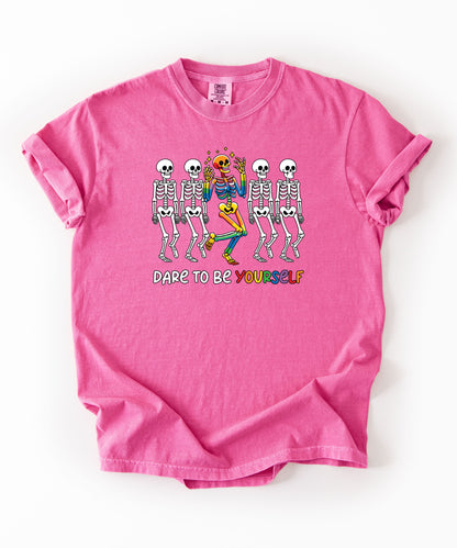 Dare to Be Yourself Rainbow Skeleton T-Shirt in Crunchberry — garment-dyed Halloween Pride tee