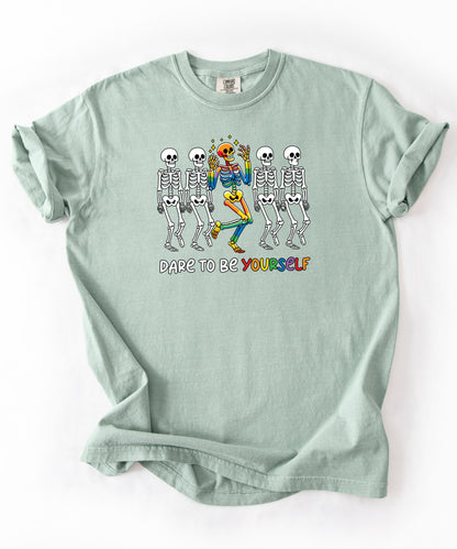 Dare to Be Yourself Rainbow Skeleton T-Shirt in Bay — garment-dyed Halloween Pride tee