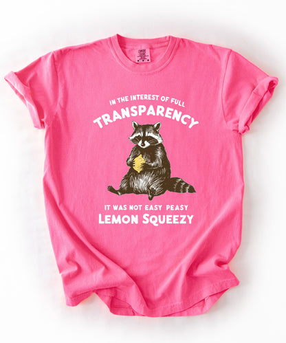 Funny raccoon sarcastic meme t-shirt in Neon pink — "Was Not Easy Peasy Lemon Squeezy" graphic tee