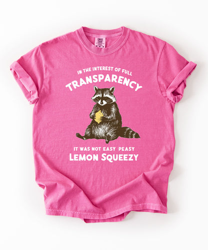 Funny raccoon sarcastic meme t-shirt in Crunchberry — "Was Not Easy Peasy Lemon Squeezy" graphic tee