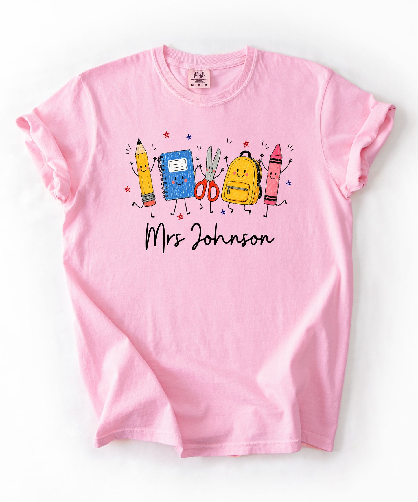 Personalized teacher t-shirt in Blossom with custom name printed on front — soft garment-dyed cotton tee, sizes S–4XL