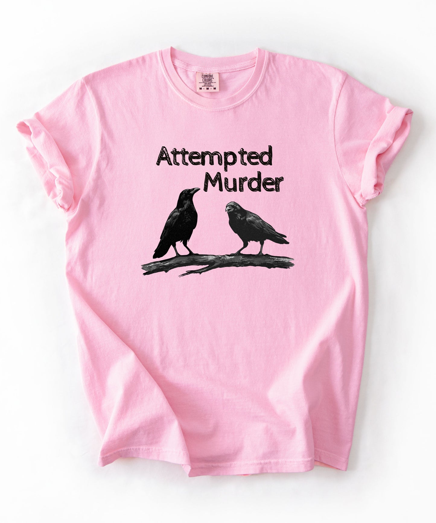Blossom garment-dyed unisex crow graphic tee — Attempted Murder dark humor bird pun shirt