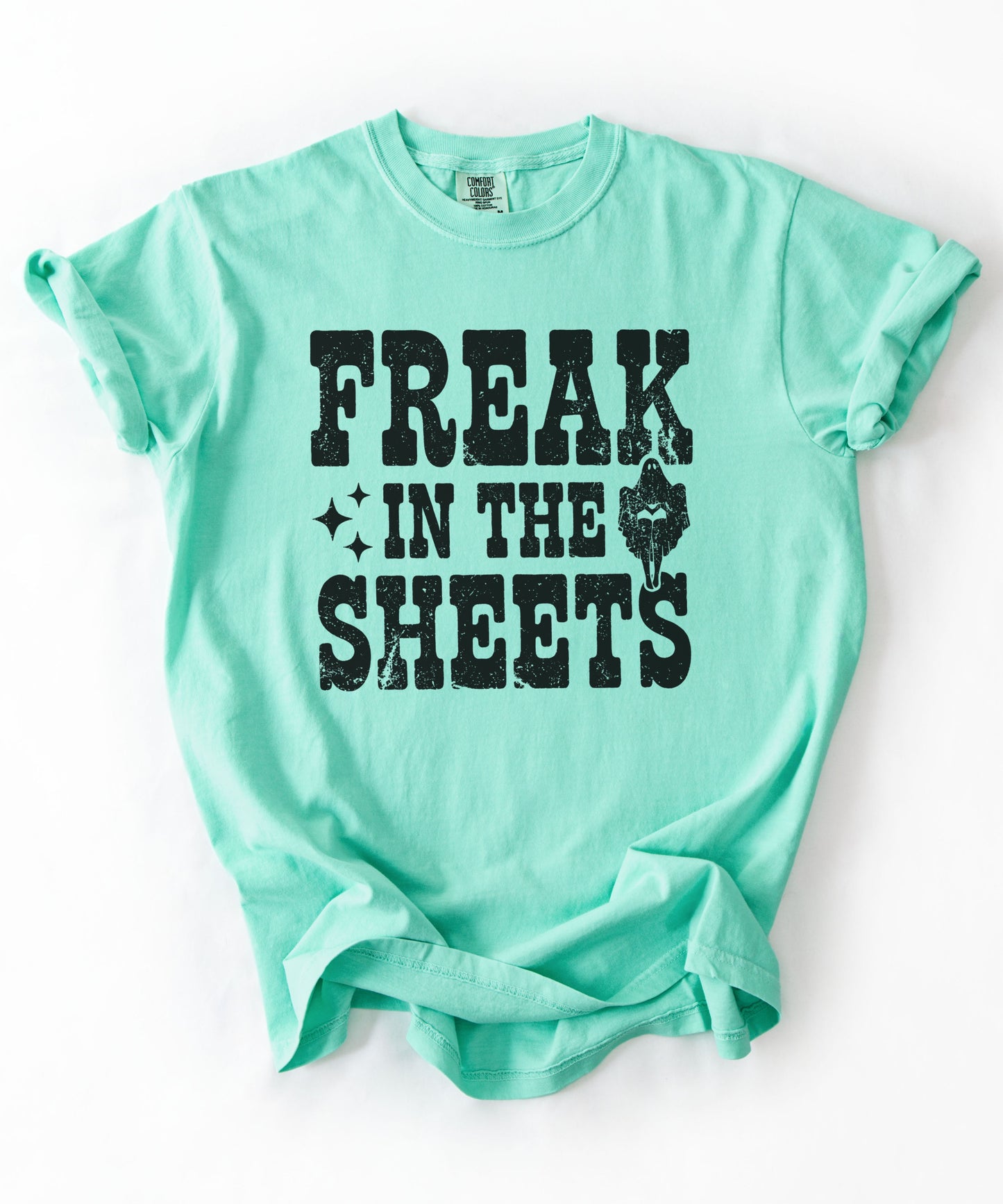 Island Reef Comfort Colors Freak in the Sheets funny Halloween ghost graphic tee — distressed western lettering with ghost and sparkle accents, flat lay