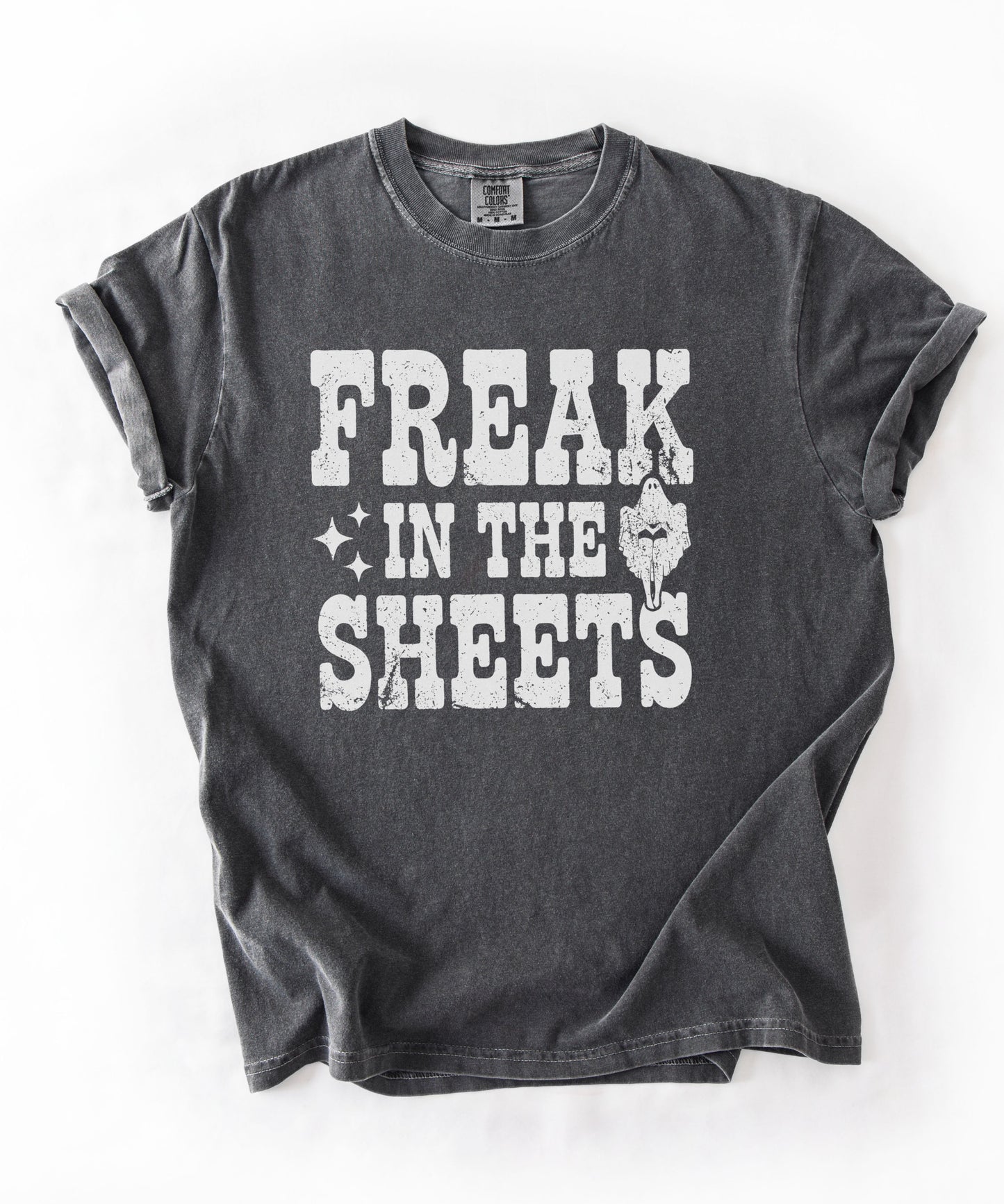 Pepper Comfort Colors Freak in the Sheets  funny Halloween ghost graphic tee — distressed western lettering with ghost and sparkle accents, flat lay