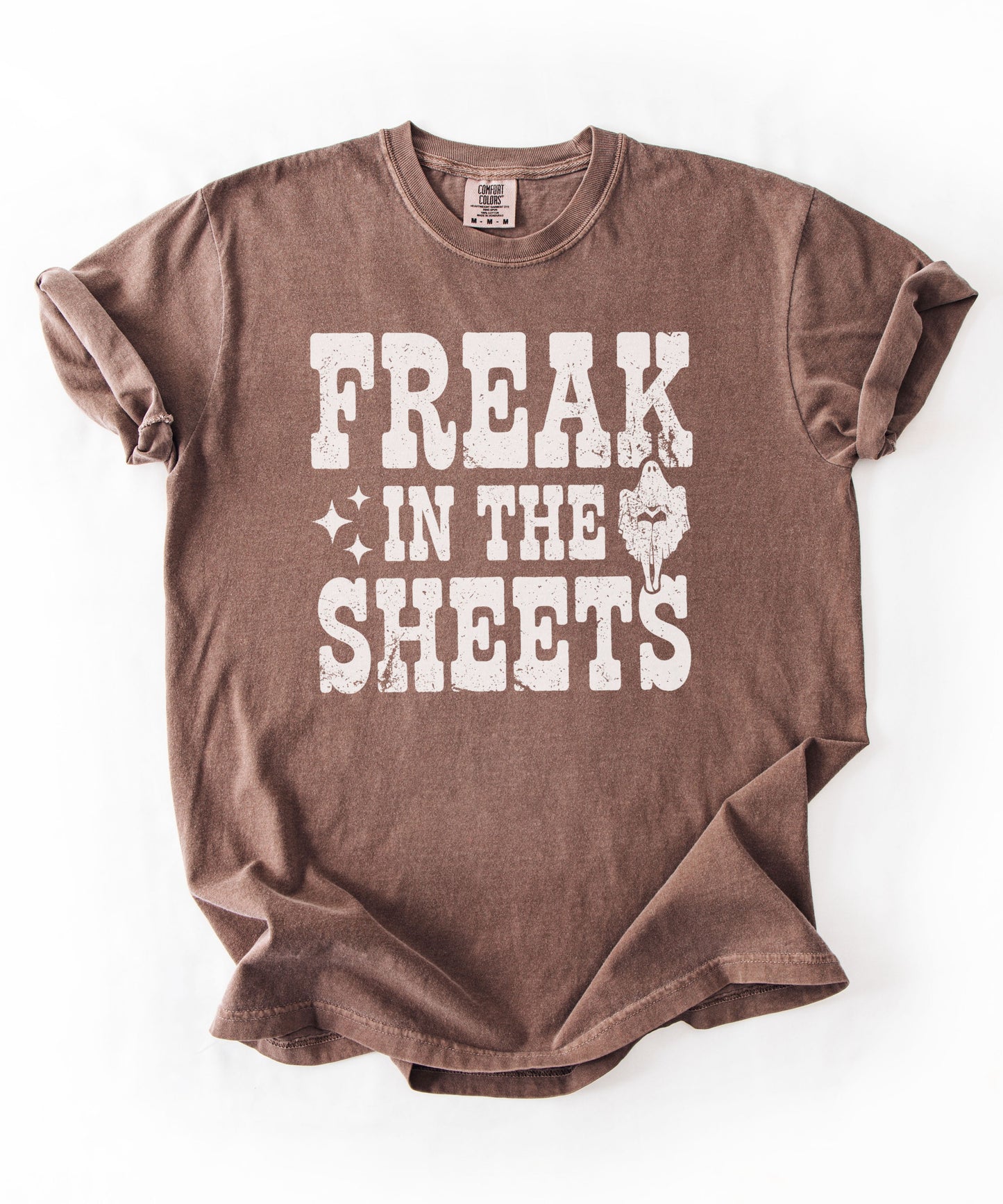 Espresso Comfort Colors Freak in the Sheets funny Halloween ghost graphic tee — distressed western lettering with ghost and sparkle accents, flat lay