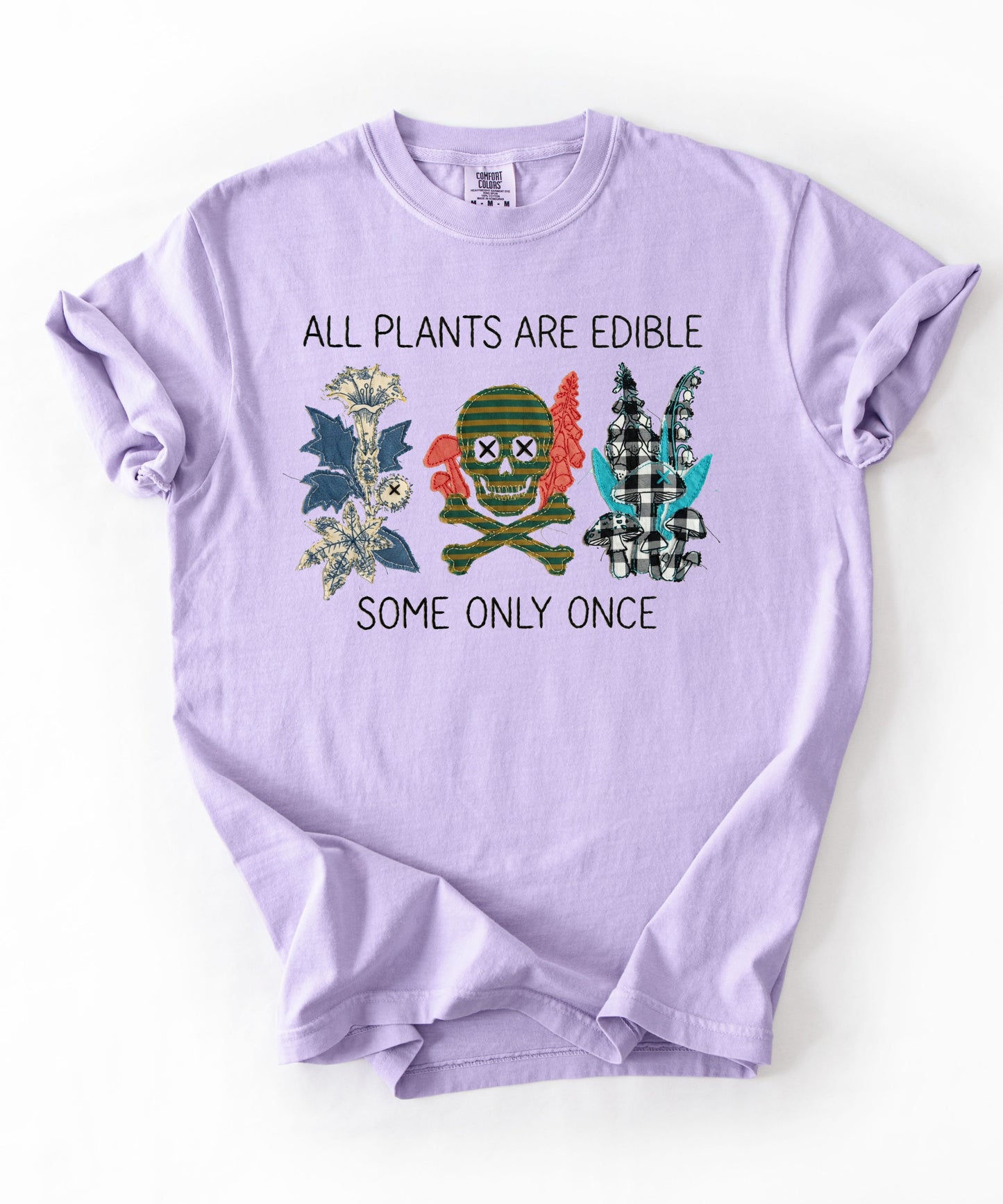 All plants are edible some only once funny botanical graphic t-shirt in Orchid, garment-dyed cotton tee with skull design