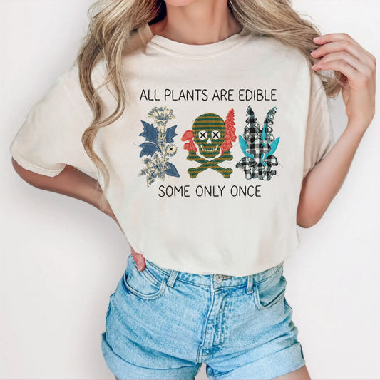 All plants are edible some only once funny botanical graphic t-shirt in Ivory, garment-dyed cotton tee with skull design
