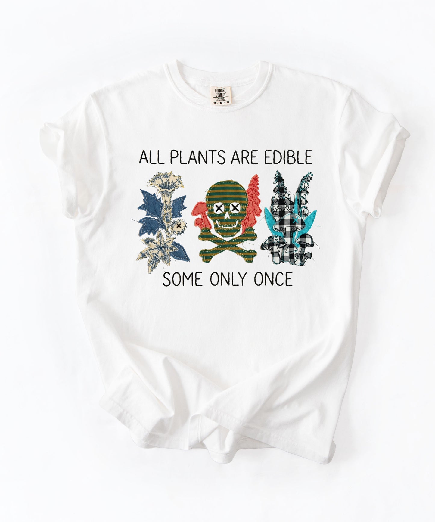 All plants are edible some only once funny botanical graphic t-shirt in white, garment-dyed cotton tee with skull design