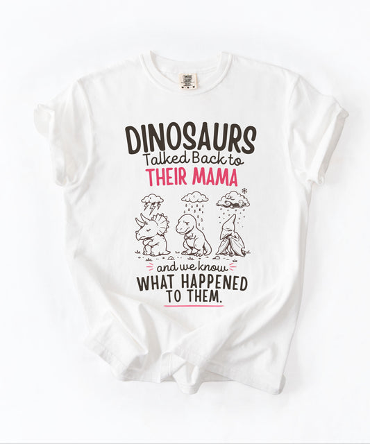 White color Funny dinosaur graphic tee featuring retro dino illustration with phrase "Dinosaurs talked back to their mama and we know what happened to them" — front view on garment-dyed cotton
