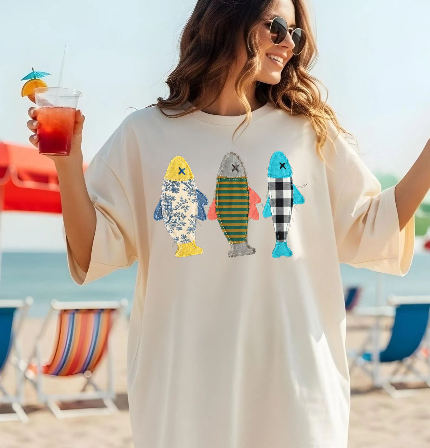 Faux patterned fish trio graphic tee in Ivory showing the floral, stripe, and buffalo-check fish prints — color variant