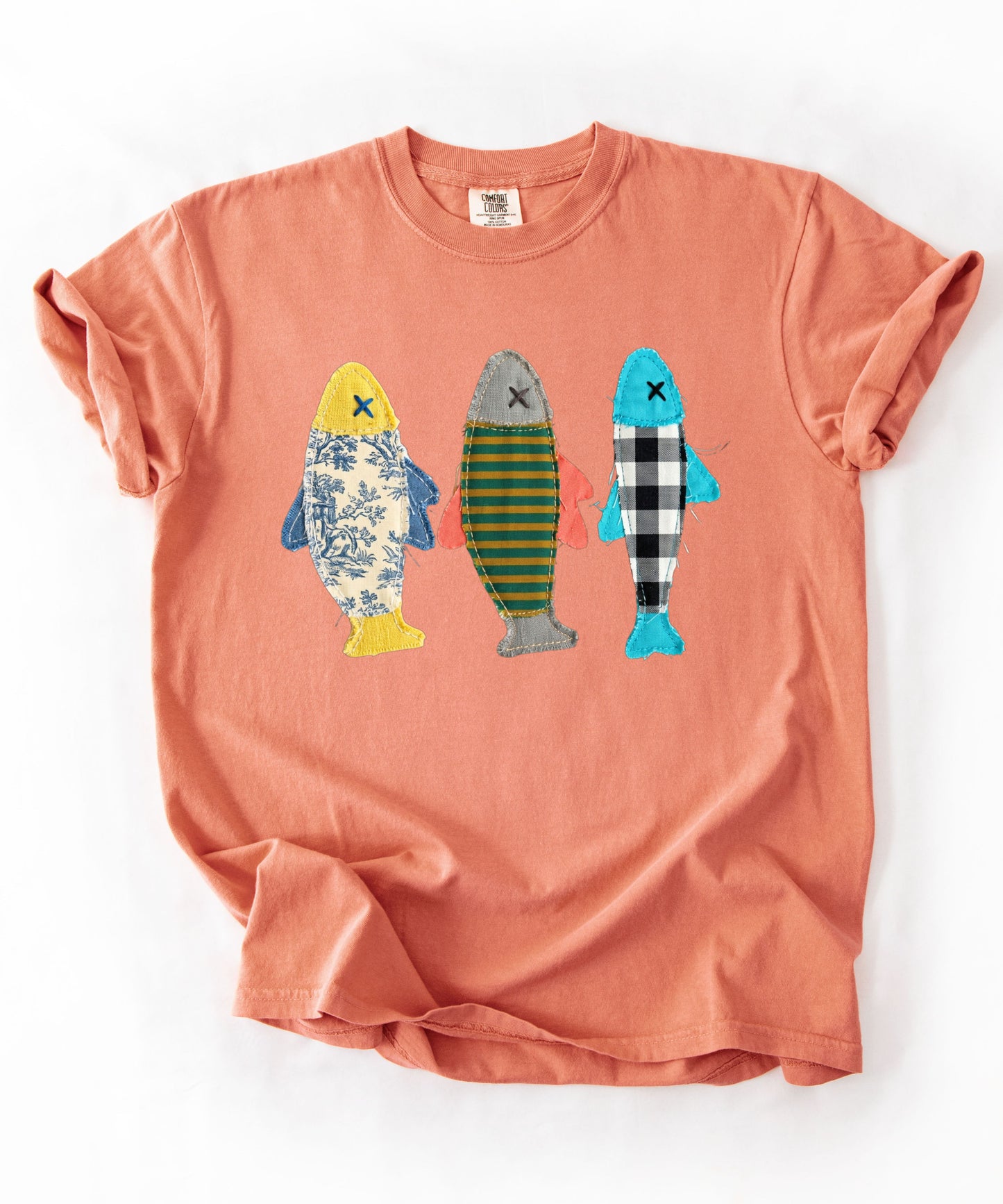 Faux patterned fish trio graphic tee in Terracota showing three fish with textile-inspired faux prints — color mockup
