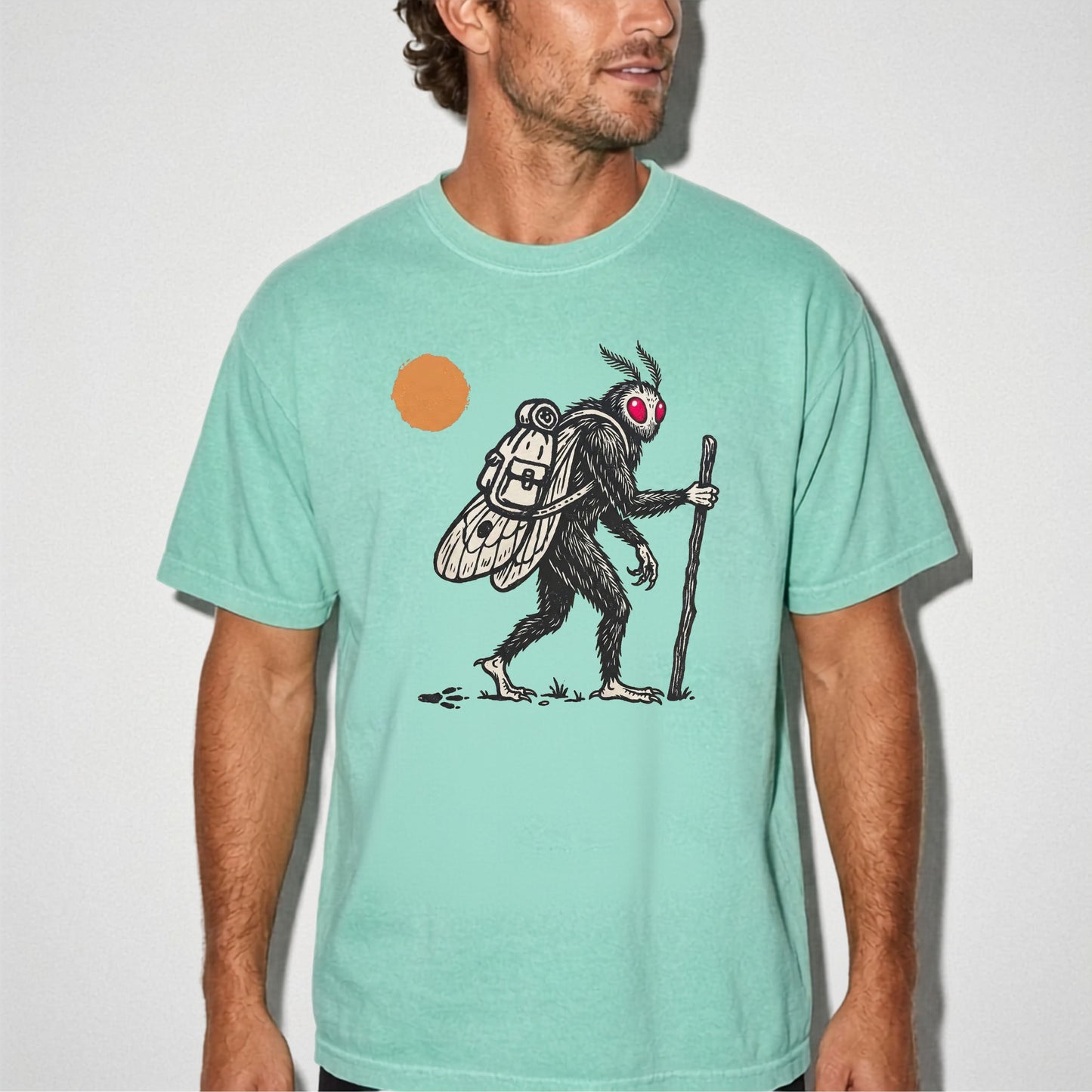 Mothman Traveler Graphic T-Shirt in Island Reef — backpacking cryptid tee with sun